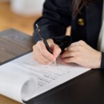 Business woman signing a contract